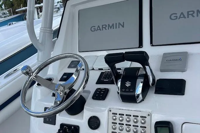 2017 Intrepid boat dashboard with Garmin navigation and Suzuki controls.