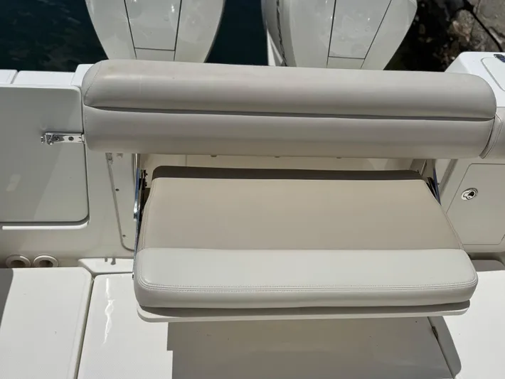  Yacht Photos Pics 2020 Boston Whaler 280 Outrage boat seat, beige upholstery, folded position.