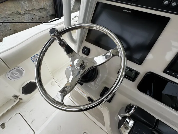  Yacht Photos Pics Steering wheel and controls of a 2020 Boston Whaler 280 Outrage boat.