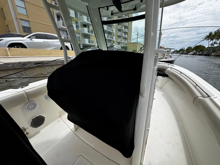  Yacht Photos Pics 2020 Boston Whaler 280 Outrage boat interior, docked near waterfront buildings.