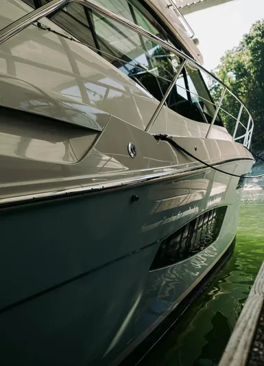  Yacht Photos Pics 2021 Regal 38 Grande Coupe yacht docked, showcasing sleek design and modern features.