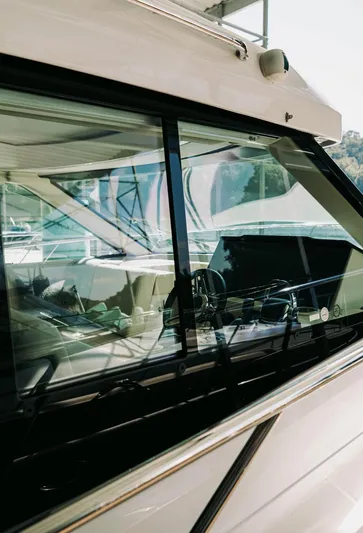  Yacht Photos Pics 2021 Regal 38 Grande Coupe yacht, sleek design with reflective windows and modern interior.