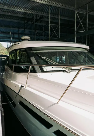  Yacht Photos Pics 2021 Regal 38 Grande Coupe yacht in a marina, showcasing sleek design and modern features.