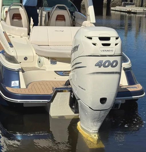  Yacht Photos Pics 2023 Chris-Craft Launch 28 GT with Mercury Verado 400 engine, docked on calm water.