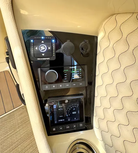  Yacht Photos Pics 2023 Chris-Craft Launch 28 GT dashboard with modern controls and beige upholstery.