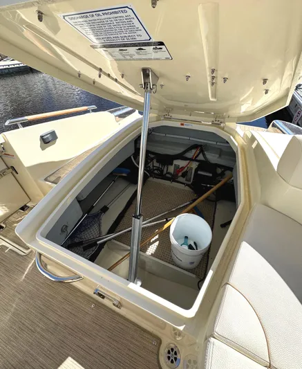  Yacht Photos Pics 2023 Chris-Craft Launch 28 GT storage compartment open, showcasing interior space and equipment.