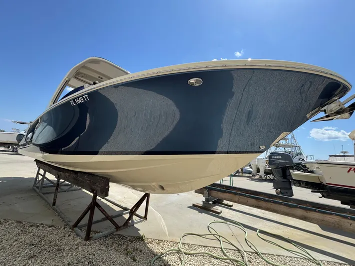  Yacht Photos Pics 2023 Chris-Craft Launch 28 GT boat on display, showcasing sleek design and craftsmanship.