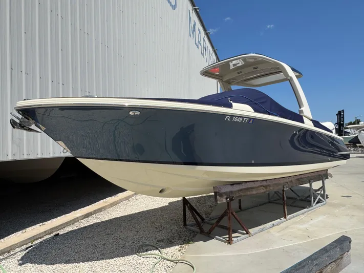  Yacht Photos Pics 2023 Chris-Craft Launch 28 GT boat displayed outdoors on a stand.