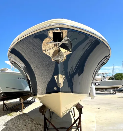  Yacht Photos Pics 2023 Chris-Craft Launch 28 GT boat, sleek design, docked under clear blue sky.