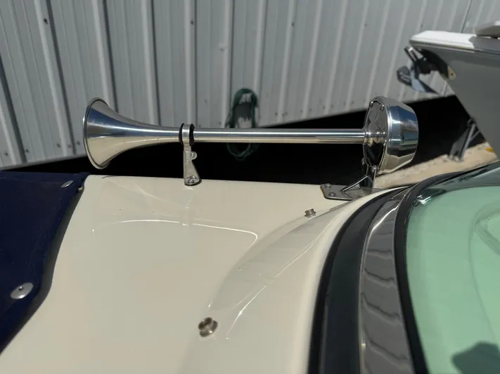  Yacht Photos Pics 2023 Chris-Craft Launch 28 GT boat horn, chrome finish, docked near metal siding.