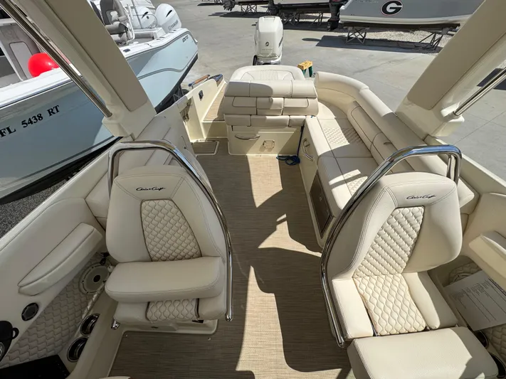  Yacht Photos Pics 2023 Chris-Craft Launch 28 GT interior with luxurious beige seating and elegant design.