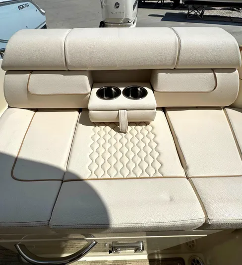  Yacht Photos Pics 2023 Chris-Craft Launch 28 GT boat seat with cup holders, beige upholstery.
