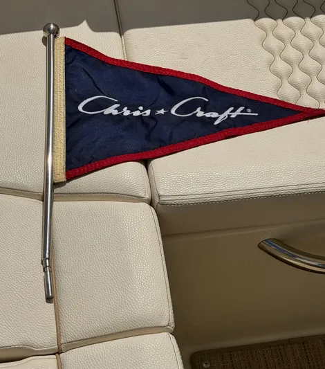  Yacht Photos Pics 2023 Chris-Craft Launch 28 GT flag on beige boat seating.