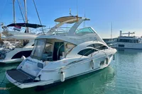 2007 Cruisers Yachts 447 Sport Sedan docked in marina, sunny day.