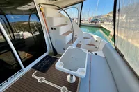 2007 Cruisers Yachts 447 Sport Sedan interior with seating, table, and spiral staircase.