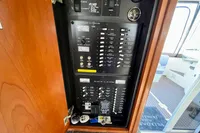 Electrical control panel inside 2007 Cruisers Yachts 447 Sport Sedan, showing switches and controls.