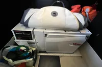 2007 Cruisers Yachts 447 Sport Sedan marine generator with storage items.