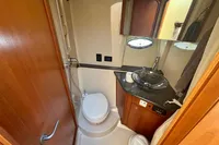 2007 Cruisers Yachts 447 Sport Sedan bathroom with toilet, sink, and shower.