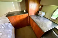 2007 Cruisers Yachts 447 Sport Sedan cabin with wood cabinetry and countertop.