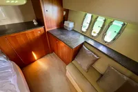 Luxurious interior of 2007 Cruisers Yachts 447 Sport Sedan with elegant wood cabinetry.