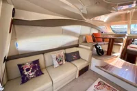 Luxurious interior of 2007 Cruisers Yachts 447 Sport Sedan with cozy seating and decor.