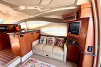 Luxurious interior of 2007 Cruisers Yachts 447 Sport Sedan with sofa and entertainment area.