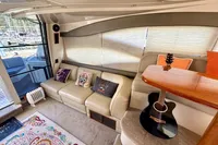 Luxurious 2007 Cruisers Yachts 447 Sport Sedan interior with cozy seating and decorative pillows.