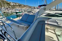 2007 Cruisers Yachts 447 Sport Sedan, luxurious seating on deck, marina background.