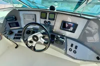 2007 Cruisers Yachts 447 Sport Sedan helm with navigation instruments and steering wheel.