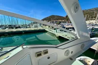 2007 Cruisers Yachts 447 Sport Sedan at marina, clear sky, scenic view.