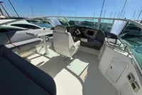 2007 Cruisers Yachts 447 Sport Sedan helm with seating and marina view.