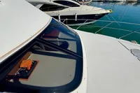 2007 Cruisers Yachts 447 Sport Sedan docked in a marina, showcasing sleek design and luxury.