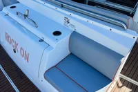 2007 Cruisers Yachts 447 Sport Sedan, deck seating area with "Rock On" text.