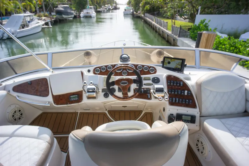  Yacht Photos Pics 2007 Meridian 459 Motoryacht helm with luxurious controls and canal view.