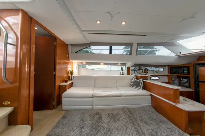  Yacht Photos Pics Luxurious interior of 2007 Meridian 459 Motoryacht with white sofa and wooden accents.