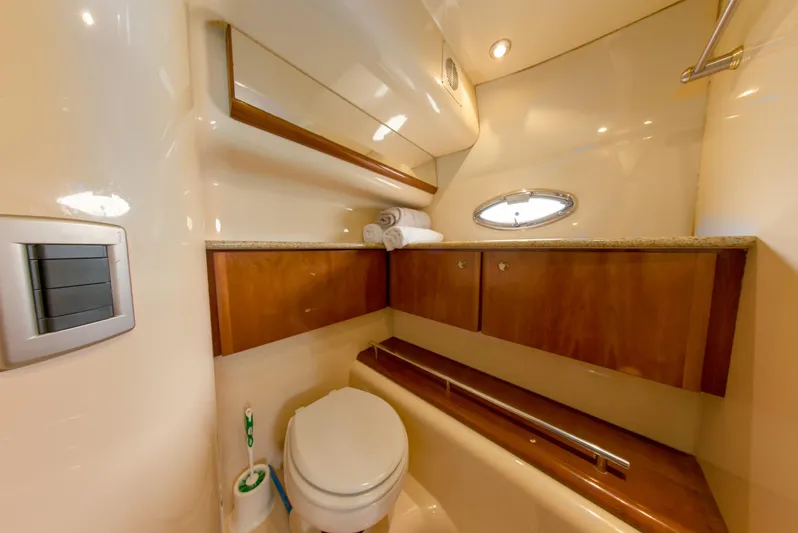  Yacht Photos Pics Luxurious bathroom in 2007 Meridian 459 Motoryacht with wood cabinets and porthole window.