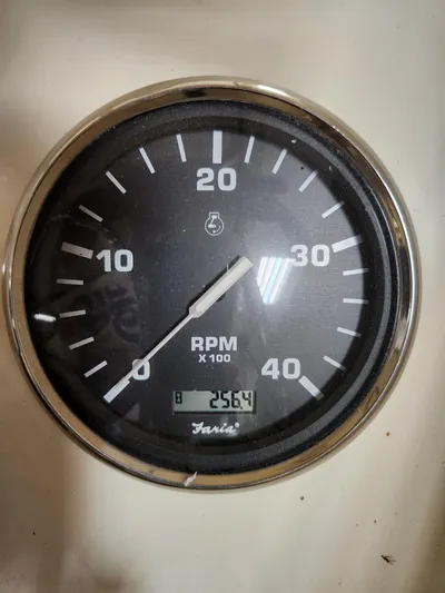  Yacht Photos Pics Close-up of a 2010 Mainship Pilot 31 RPM gauge displaying 2564 RPM.