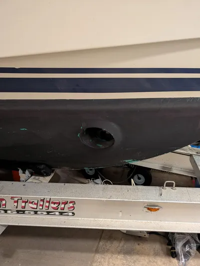  Yacht Photos Pics 2010 Mainship Pilot 31 boat hull on trailer, featuring a visible hole.