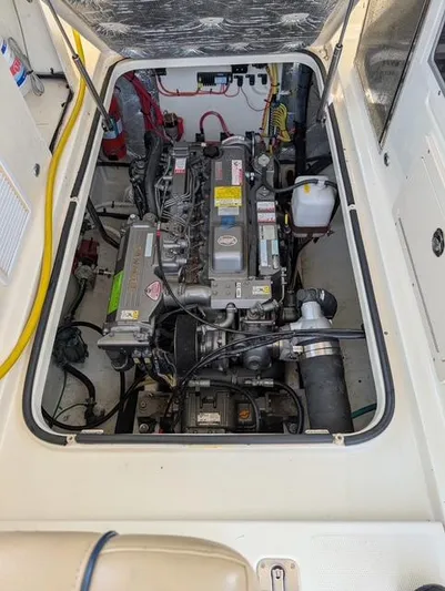  Yacht Photos Pics 2010 Mainship Pilot 31 engine compartment, showcasing detailed mechanical components and wiring.
