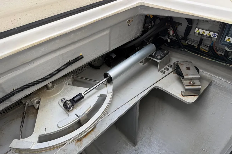 Muse Yacht Photos Pics Steering mechanism of 2019 Nautitech 40 Open catamaran, showcasing hydraulic components and cables.