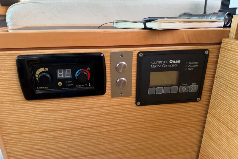 Muse Yacht Photos Pics Control panel of a 2019 Nautitech 40 Open with Cummins Onan marine generator.