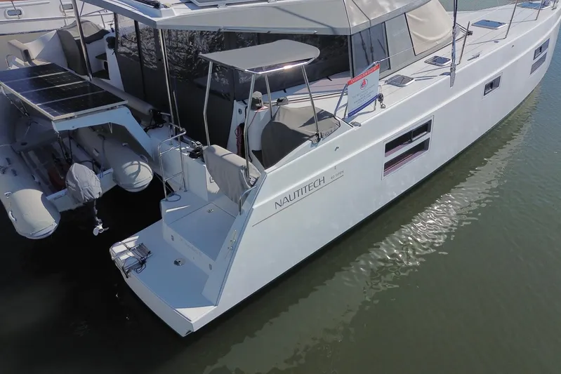 Muse Yacht Photos Pics 2019 Nautitech 40 Open catamaran docked, featuring sleek design and solar panels.