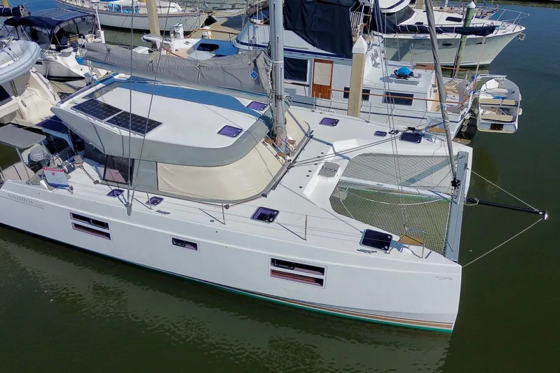 Muse Yacht Photos Pics 2019 Nautitech 40 Open catamaran docked, featuring solar panels and spacious deck.