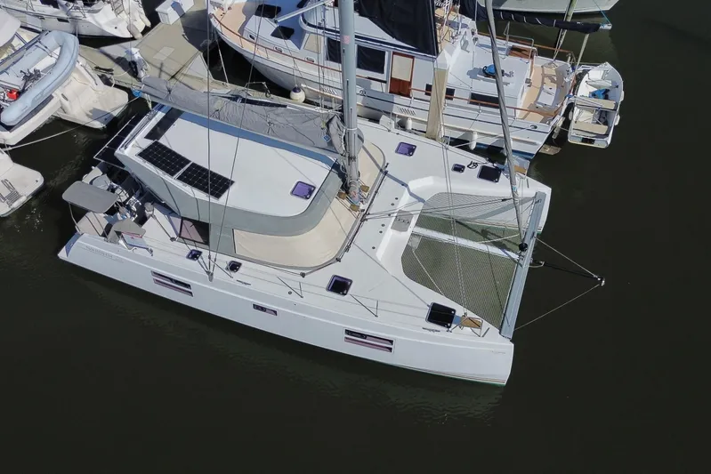 Muse Yacht Photos Pics Aerial view of 2019 Nautitech 40 Open catamaran docked at marina.