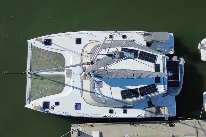 Muse Yacht Photos Pics Aerial view of 2019 Nautitech 40 Open catamaran with solar panels docked.