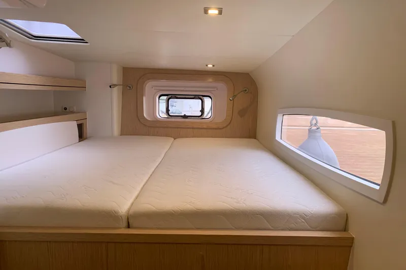 Spekeend Yacht Photos Pics Interior of 2021 Outremer 51 yacht cabin with bed and windows.