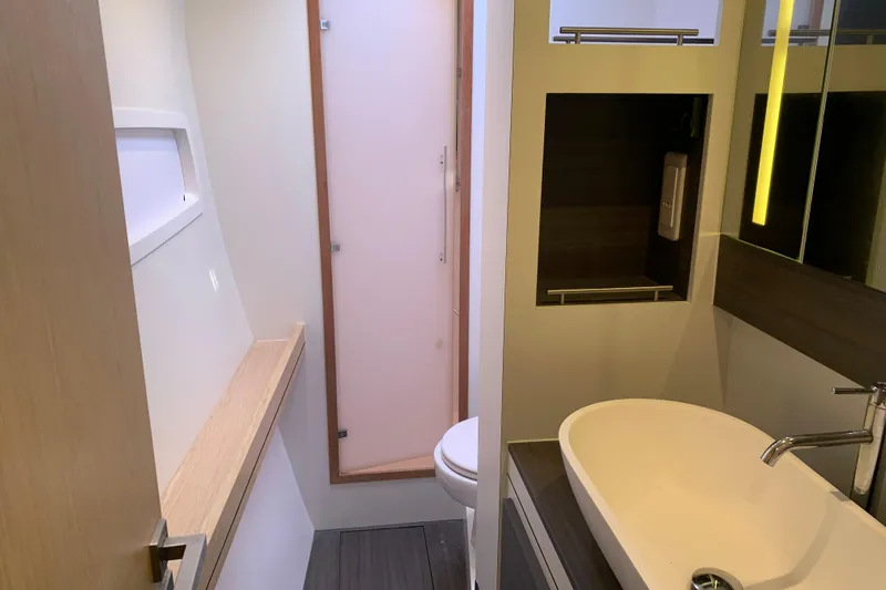 Spekeend Yacht Photos Pics Modern bathroom in 2021 Outremer 51 yacht with sleek sink and mirror.