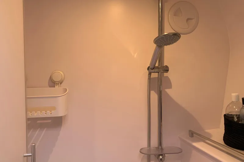 Spekeend Yacht Photos Pics Shower area in 2021 Outremer 51 yacht with modern fixtures and storage.