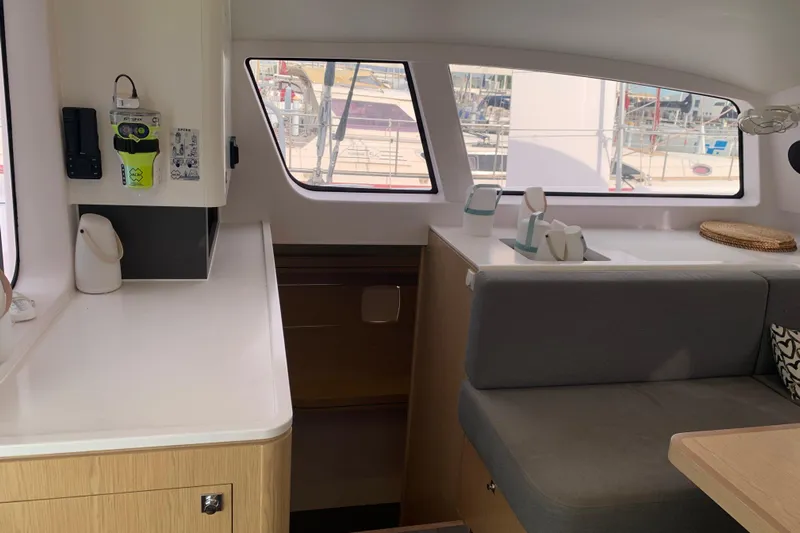 Spekeend Yacht Photos Pics Interior of 2021 Outremer 51 catamaran, featuring modern seating and large windows.