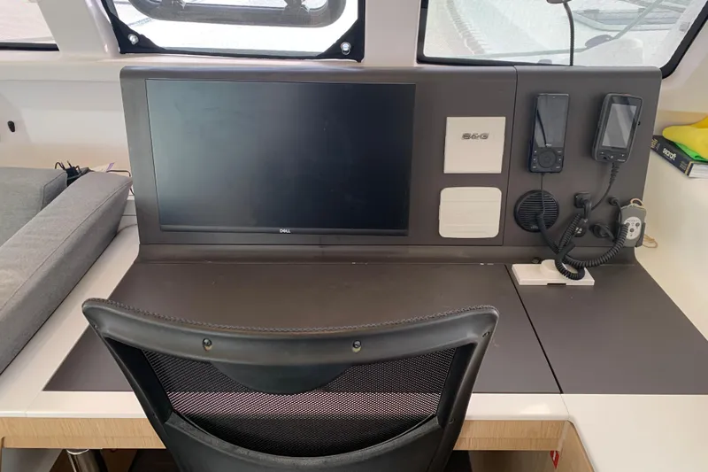 Spekeend Yacht Photos Pics Navigation station of 2021 Outremer 51 catamaran with monitor and communication devices.